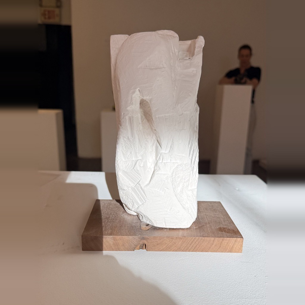 CityScape, carved plaster on a wood base